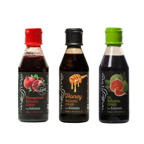 Three bottles of Messino balsamic cream with different flavors on a white background