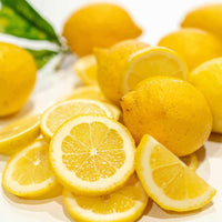 Fresh lemons both whole and sliced