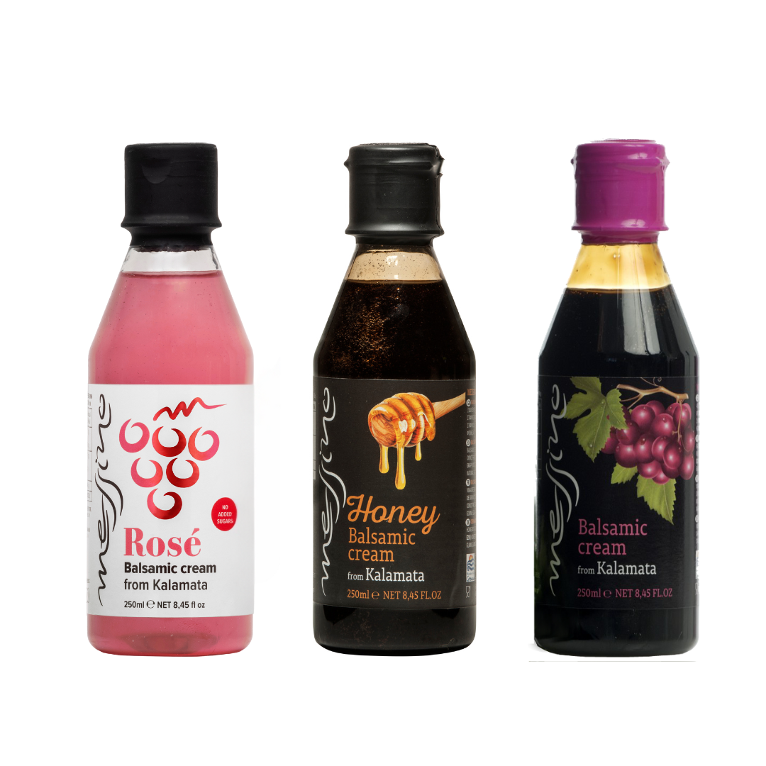 Three bottles of balsamic cream from Kalamata on a white background