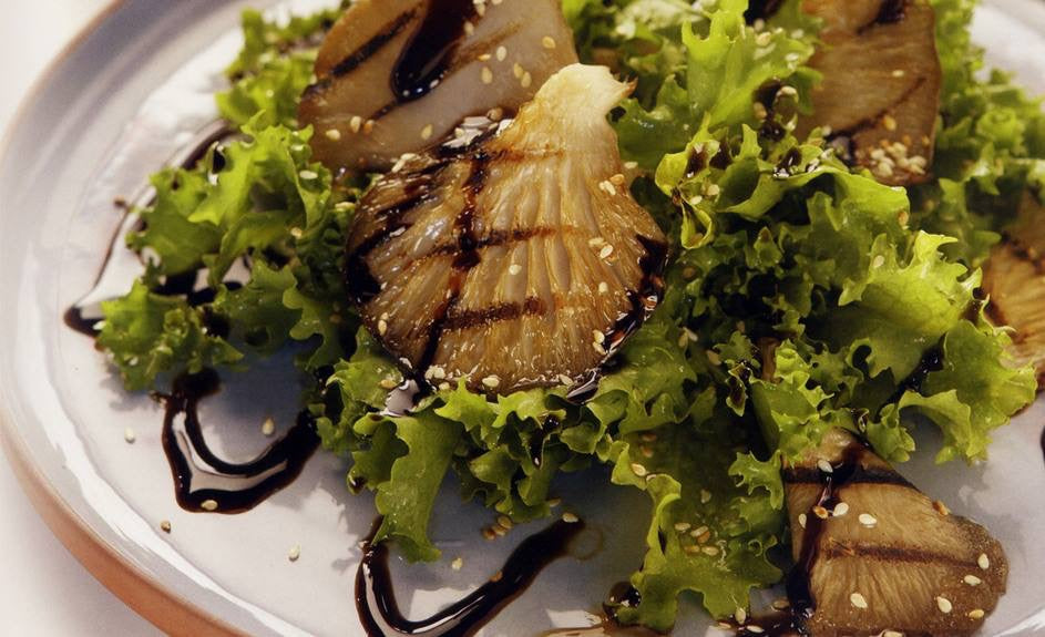 Plated salad drizzled with Messino Truffle Balsamic Glaze