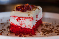 Piece of cake topped with Messino Pomegranate Pearls