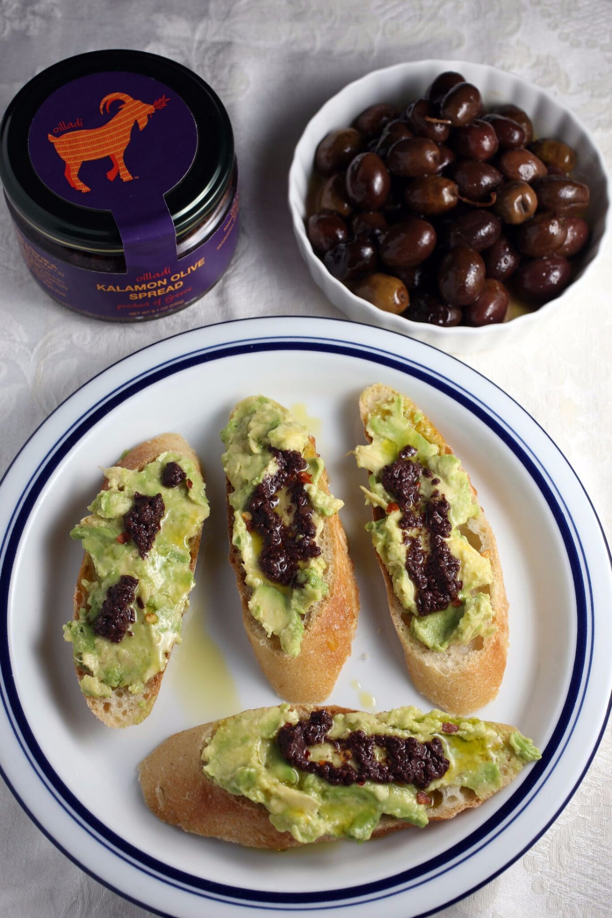 Oilladi Kalamon olive spread, avocado on bread with olives
