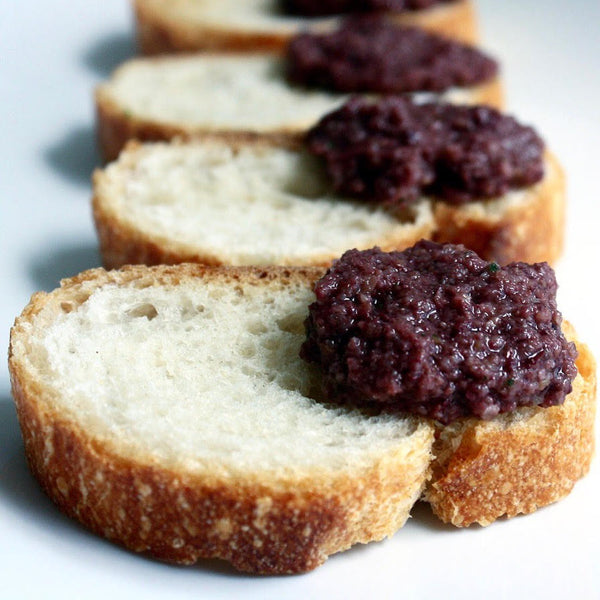 Oilladi kalamon olive spread on slices of bread